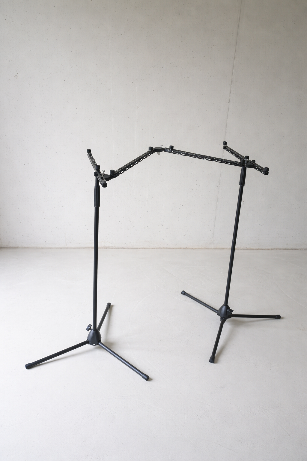 Lightweight modular touring stand frame built with Manofold structural rails and locking hinges, packs down for travel