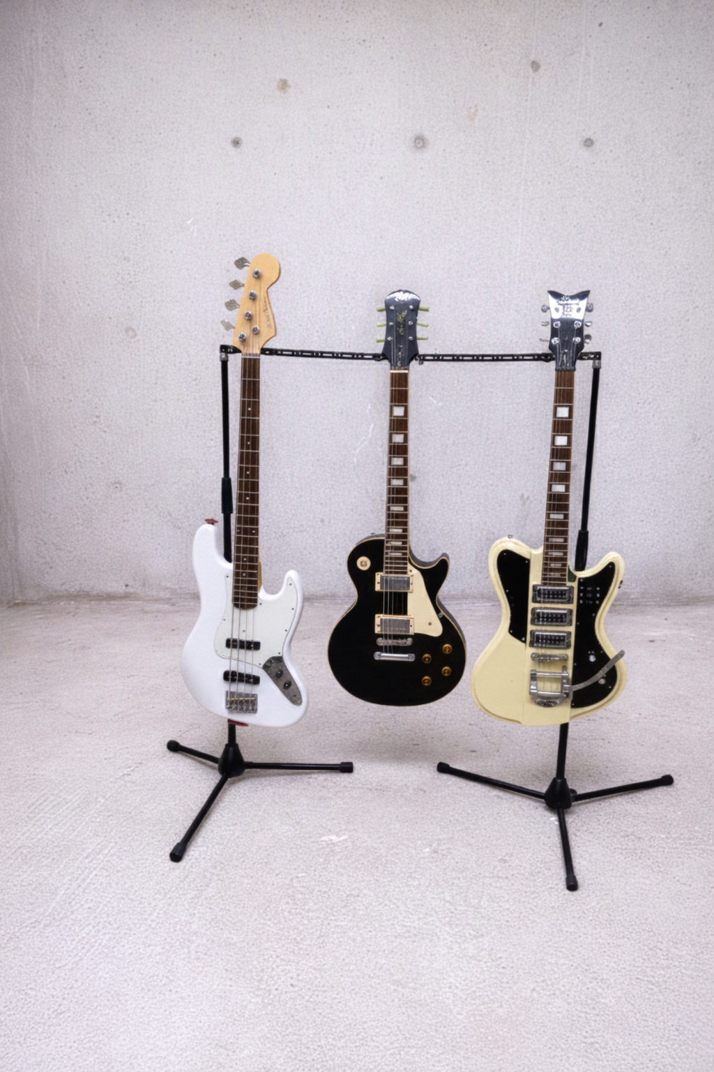 Space-saving multi-guitar rack built from Manofold modular hardware and standard mic stand bases