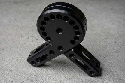 Black metal mechanical component on a gray surface