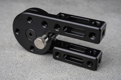 Black metal mechanical component on a gray surface